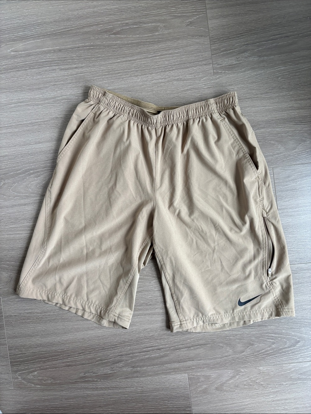 Nike Men’s Khaki Dri-fit Shorts with side zip pocket. Size Large.